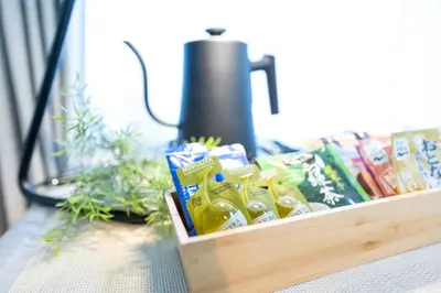 a tray of snacks on a table next to a blender at Shirokanedai guest suite in Tokyo