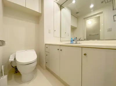 a white bathroom with a toilet and a sink at Pangoo Shinagawa Room 502 - Vacation STAY 99413v in Tokyo