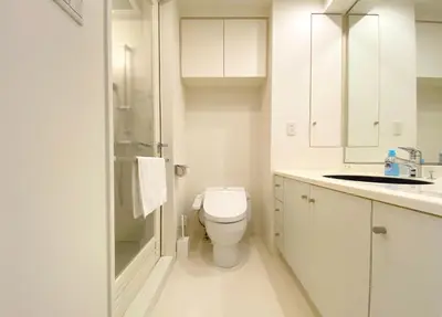 a white bathroom with a toilet and a sink at Pangoo Shinagawa Room 502 - Vacation STAY 99413v in Tokyo