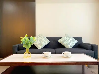 a coffee table with two cups and a blue couch at Pangoo Shinagawa Room 203 - Vacation STAY 03802v in Tokyo
