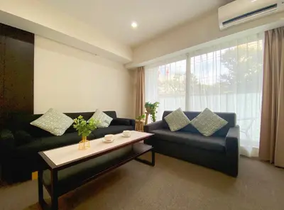 a living room with two couches and a coffee table at Pangoo Shinagawa Room 203 - Vacation STAY 03802v in Tokyo