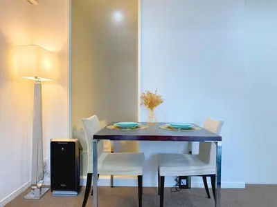a dining room table with white chairs and a blue table at Pangoo Shinagawa Room 203 - Vacation STAY 03802v in Tokyo