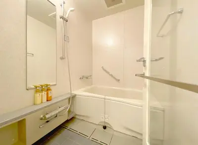 a white bathroom with a tub and a sink at Pangoo Shinagawa Room 203 - Vacation STAY 03802v in Tokyo
