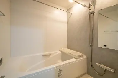 a white bathroom with a tub and a shower at Oceans Residence Urayasu - Vacation STAY 18420 in Tokyo