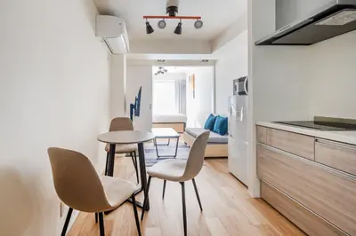 a kitchen and dining room with a table and chairs at \u30d3\u30e5\u30fc\u30ceSumida in Tokyo