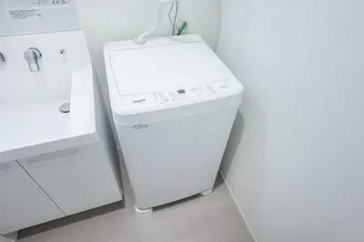 a white washer and dryer in a kitchen at \u30d3\u30e5\u30fc\u30ceSumida in Tokyo