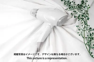 a hairdryer on top of a white dress at \u30cf\u30a4\u30ea\u30fc\u30d5\u829d\u5927\u9580 in Tokyo