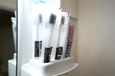 a shelf with toothbrushes and toothpaste in a bathroom at Room 202 Nishi-Shinjuku Gochome 9 minutes walk 40 square meters Sleeps up to 6 people in Tokyo