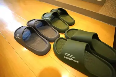 three pairs of shoes sitting on a table at Room 202 Nishi-Shinjuku Gochome 9 minutes walk 40 square meters Sleeps up to 6 people in Tokyo