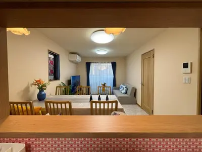 a dining room and living room with a table and chairs at Lapis House - Vacation STAY 03045v in Tokyo