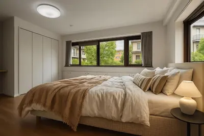 a bedroom with a large bed and two windows at \u7af9\u5185\u30d3\u30eb in Tokyo