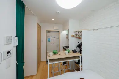 a small kitchen with a table in a room at Zenith Shinjuku Hinoki by Tranova in Tokyo