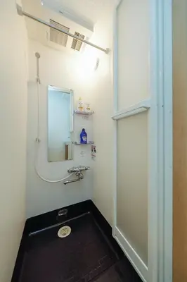a bathroom with a sink and a mirror at Zenith Shinjuku Hinoki by Tranova in Tokyo