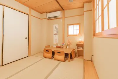 a room with a table and chairs and a door at Ginza301 Tsukiji 3 mins,Tsukiji Market in Tokyo