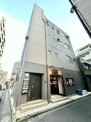 a building on the corner of a city street at Ginza301 Tsukiji 3 mins,Tsukiji Market in Tokyo