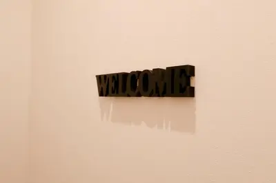 a sign on a wall with the word welcome at Cozy Japanese Room Near Skytree with Easy Airport Access in Tokyo