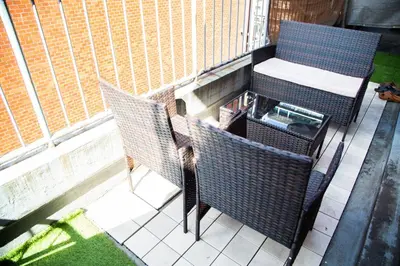 a balcony with two chairs and a table at S19\u65b0\u5bbf\u6700\u4e2d\u5fc3 \u6b4c\u821e\u4f0e\u753a \u6771\u65b0\u5bbf\u7ad95\u5206 3\u5ba41\u5385 \u6700\u59277\u4eba-Shinjuku center 3 rooms 5 mins to St, Max 7P \u76f4\u8fbe\u65b0\u5bbf \u6d89\u8c37 \u8868\u53c2\u9053 \u6c60\u888b \u4e0a\u91ce \u4ee3\u4ee3\u6728 \u94f6\u5ea7 \u539f\u5bbf in Tokyo