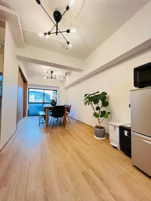 an empty room with a table and a dining room at Kameido Wisteria Retreat 2 Floor in Tokyo