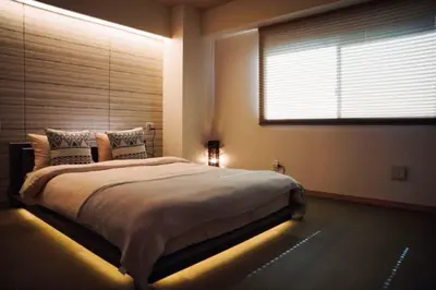 a bedroom with a large bed with a window at Kameido Wisteria Retreat 6 Floor in Tokyo