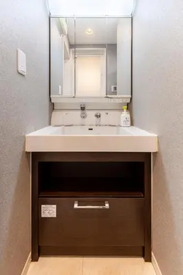 a bathroom with a sink and a mirror at Jin's Place - 15m to Haneda & Shinagawa in Tokyo