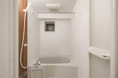 a small bathroom with a sink and a toilet at Shinjuku Raise OG House in Tokyo