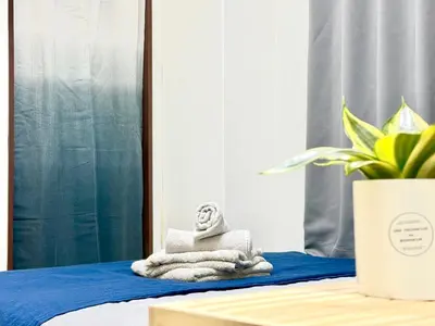 a buddha statue sitting on top of a bed at Shinjuku\u5927\u4e45\u4fdd3 in Tokyo