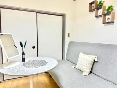 a living room with a couch and a table at Shinjuku\u5927\u4e45\u4fdd3 in Tokyo
