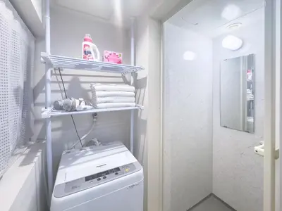 a white laundry room with a washing machine in it at Ikebukuro Walking Street, 5 minutes from the station, 4-6 people in Tokyo