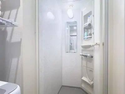 a small bathroom with a shower and a toilet at Ikebukuro Walking Street, 5 minutes from the station, 4-6 people in Tokyo