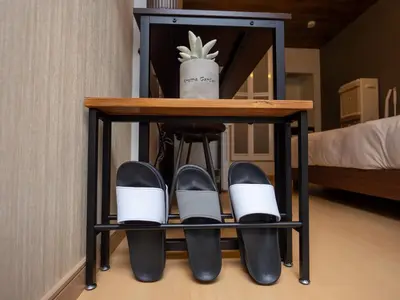 a shelf with shoes and a plant on it at Cozy Vintage Studio Asakusa Skytree Ueno Akihabara in Tokyo