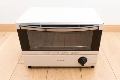 a toaster oven sitting on a kitchen floor at Cozy Vintage Studio Asakusa Skytree Ueno Akihabara in Tokyo