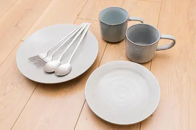 two plates and two cups and silverware on a table at Cozy Vintage Studio Asakusa Skytree Ueno Akihabara in Tokyo