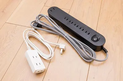 a wii remote and a video game controller on a wooden floor at Cozy Vintage Studio Asakusa Skytree Ueno Akihabara in Tokyo