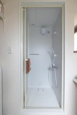 a shower with a glass door in a bathroom at Close to SHIBUYA! 6beds New & Comfortable Stay! in Tokyo