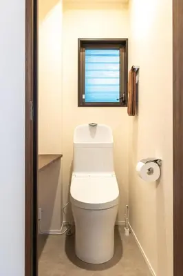 a bathroom with a white toilet with a window at Close to SHIBUYA! 6beds New & Comfortable Stay! in Tokyo