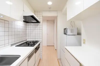 a white kitchen with a sink and a refrigerator at Ms\u30d3\u30ebll in Tokyo