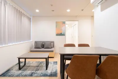 a dining room with a table and chairs at Ms\u30d3\u30ebll in Tokyo