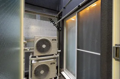 a room with two air conditioners and a window at Ms\u30d3\u30ebll in Tokyo