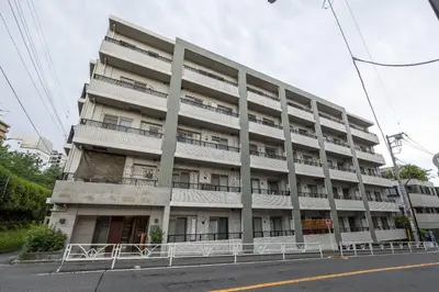 an apartment building with balconies on the side of a street at \u30eb\u30af\u30ec\u521d\u53f0 in Tokyo