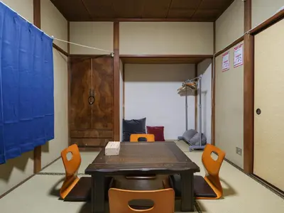 a conference room with a table and chairs at Shinkian Kameido Kinshicho -\u795e\u4e80\u5eb5 \u4e80\u6238 \u9326\u7cf8\u753a- JR\u4e80\u6238\u99c5\u5f92\u6b696\u5206 1\u68df\u8cb8\u5207 \u30ea\u30ce\u30d9\u30fc\u30b7\u30e7\u30f3\u6e08\u307f\u306e\u548c\u98a8\u5bbf \u7121\u6599Wi-Fi in Tokyo