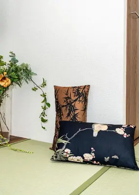 a pillow sitting on the floor in a room with at OHAYO AN asakusa in Tokyo