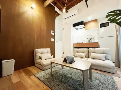 a living room with a couch and a table at SSr\u5927\u548c\u753a1\u4e01\u76ee in Tokyo