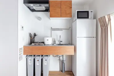 a small kitchen with a sink and a refrigerator at SSr\u5927\u548c\u753a1\u4e01\u76ee in Tokyo