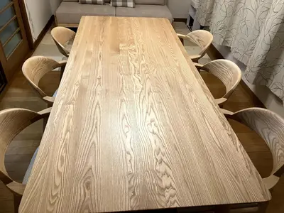 a wooden table with four chairs around it at NKm\u6625\u6c5f\u753a3\u4e01\u76ee in Tokyo