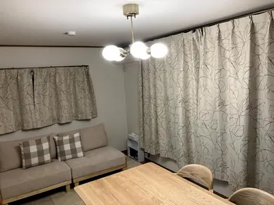 a living room with a couch and a table at NKm\u6625\u6c5f\u753a3\u4e01\u76ee in Tokyo