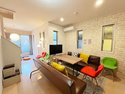 a living room with a couch and a table at \u5927\u5cf65\u4e01\u76ee in Tokyo