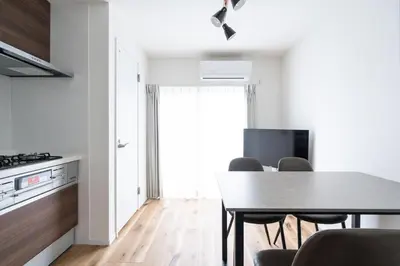 a kitchen and dining room with a table and chairs at \u4eac\u5cf63\u4e01\u76ee\u8cb8\u6238\u5efa in Tokyo