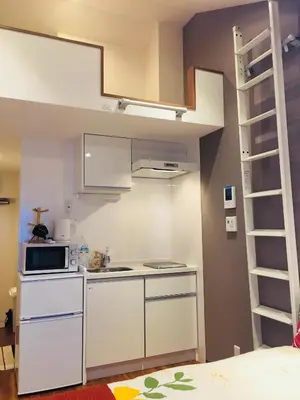 a kitchen with a loft bed in a room at Okubo House 3F SJ0277 in Tokyo