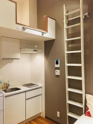 a kitchen with a loft bed in a small room at Okubo House 3F SJ0277 in Tokyo
