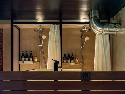 a display of bottles of wine in a room at Dogen sauna&stay in Tokyo